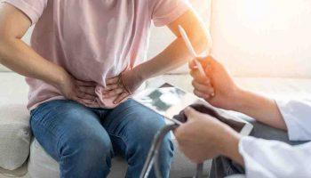 Woman holding her stomach in pain