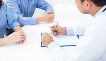 A couple having a consultation with a doctor