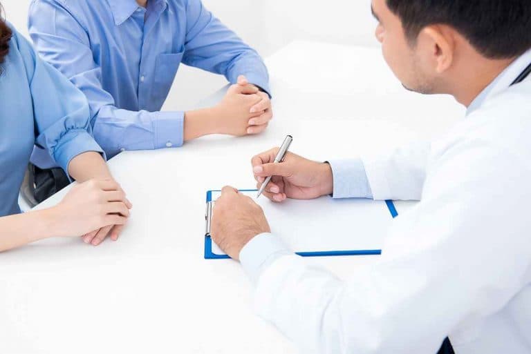 A couple having a consultation with a doctor