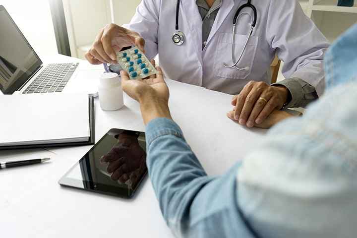 A doctor giving medication to a patient