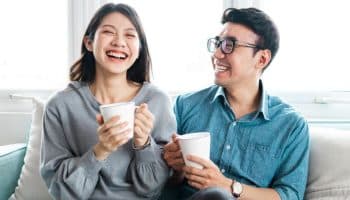 A couple of man and woman drinking tea made from medicinal herbs.