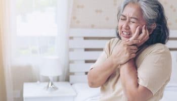 Senior women in pain for having swollen gum problem