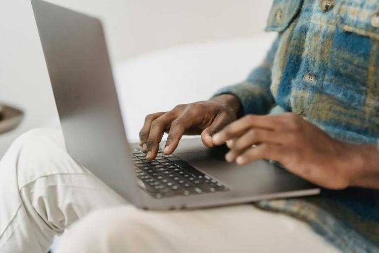 Person typing a digital journal.