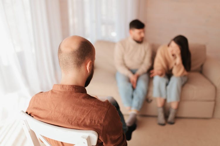 A fighting couple seeking relationship help from a therapist